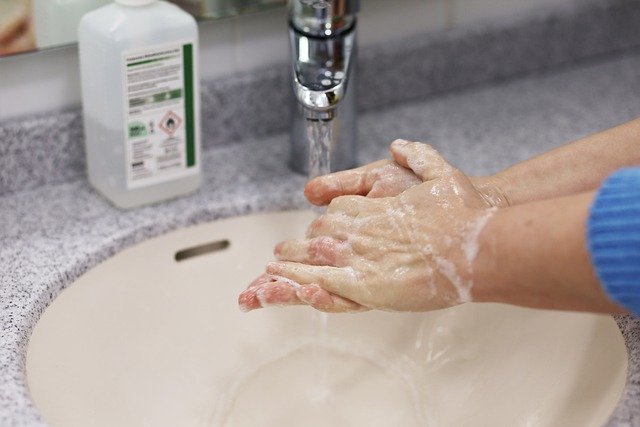 Person Sanitizing Hands